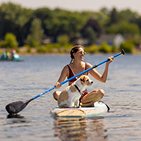 Woman with dog on paddleboard